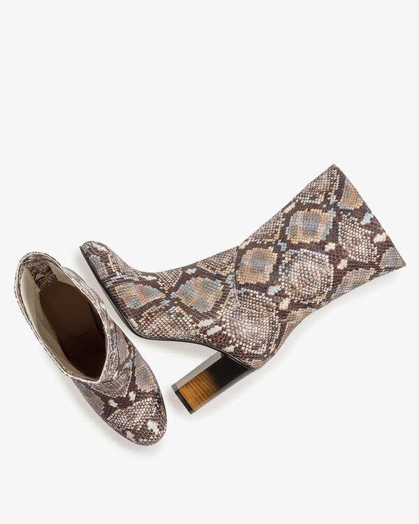 Brown and white leather boots with snake print