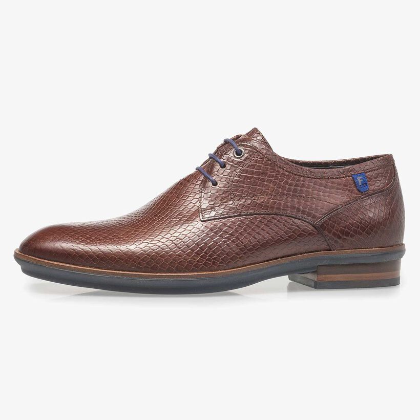 Cognac-coloured leather lace shoe with snake print
