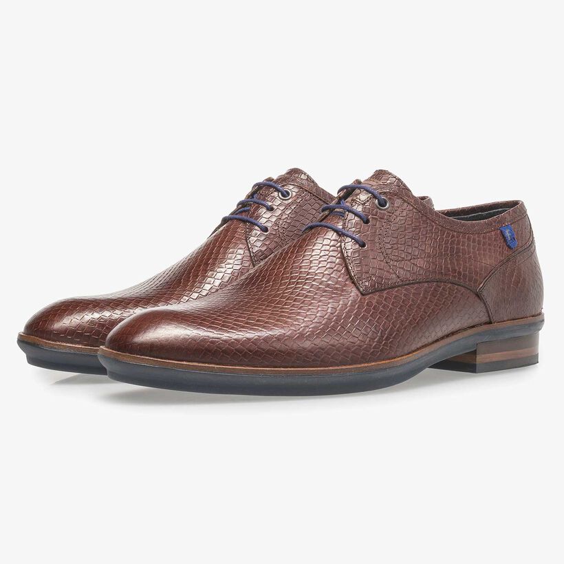 Cognac-coloured leather lace shoe with snake print